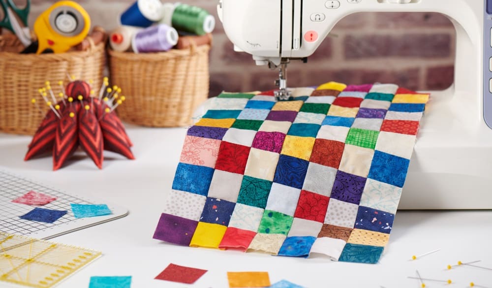 quilt sewn from square pieces on sewing machine